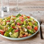 Mediterranean chickpea and avocado healthy salad with walnuts and olive oil in Malta