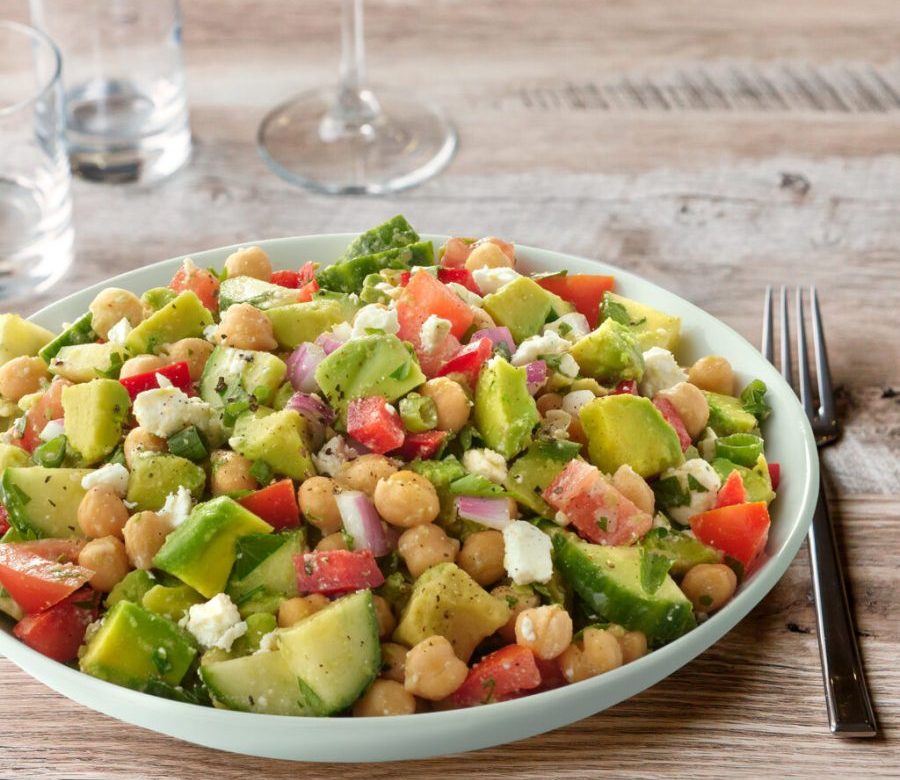 Mediterranean chickpea and avocado healthy salad with walnuts and olive oil in Malta